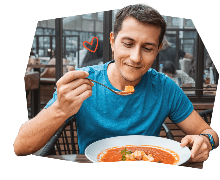 Man in blue shirt enjoying his meal