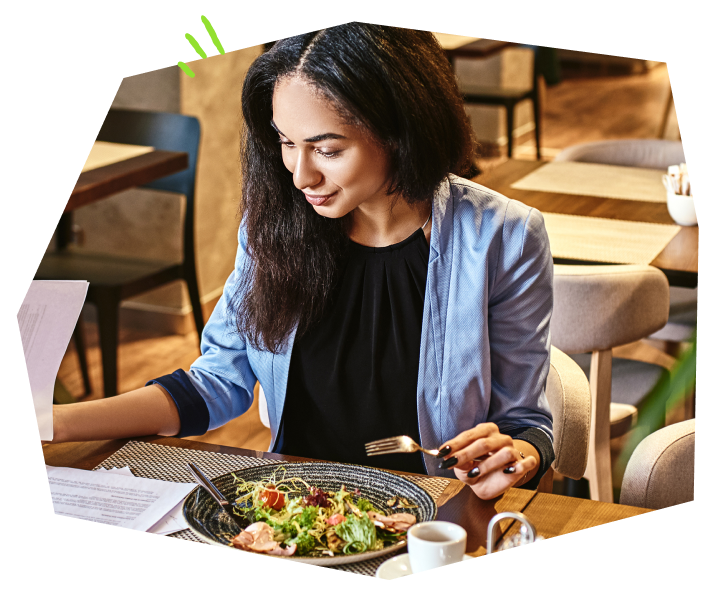 Woman in blue shirt enjoying his meal